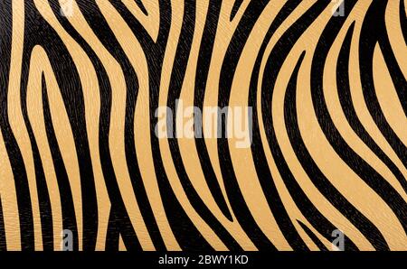 Gold with black stripes synthetic leather with embossed background texture. Close up. Copy space. Stock Photo