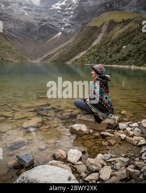 Beautiful blue lake in the middle of the mountains in Peru. Turquoise water lake. Stock Photo