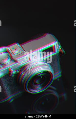 retro camera with leather strap on a black background. Glitch effect Stock Photo
