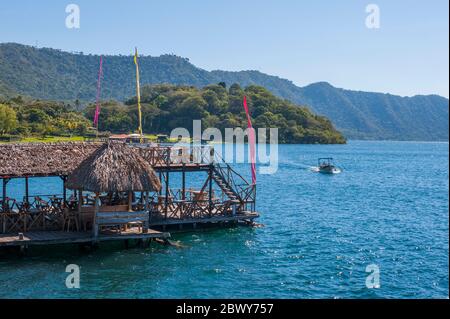 A restaurant on the shore of Lake Coatepeque in the Caldera De Coatepeque, a volcanic caldera in El Salvador in Central America. Stock Photo