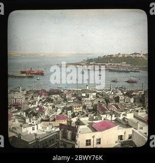 Istanbul Constantinople view from Galata cross the Golden Horn to the Seraglio Point (Sarayburnu) with the crossing of Marmara and Bosphorus at the left. Hand colored slide from around 1910. Photograph on dry glass plate from the Herry W. Schaefer collection. Stock Photo