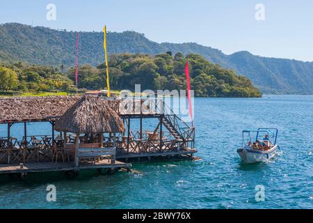 A restaurant on the shore of Lake Coatepeque in the Caldera De Coatepeque, a volcanic caldera in El Salvador in Central America. Stock Photo