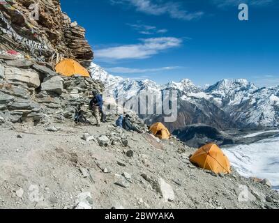 Nepal. Trek to Mera Peak. At High Camp adjacent to the Mera glacier en-route to climb Mera Peak at 6476m. Makalu 8463m, The Red Mountain and 5th highest peak in the world can be seen in the distance Stock Photo
