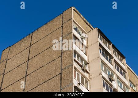 Soviet building corner on a blue sky background Stock Photo