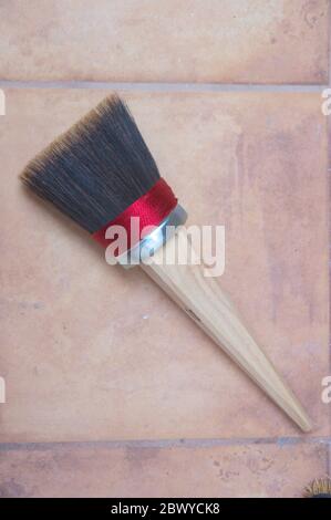 Close-up of a brush for painting smooth walls, facades, ceilings or floors, with a brush for painting with lime or glue Stock Photo