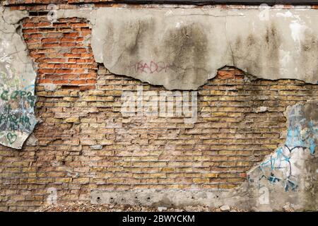 Red White Wall Background. Old Grungy Brickwork Horizontal Texture. Brickwall Backdrop. Structure With Broken Stucco And Plaster. Stock Photo