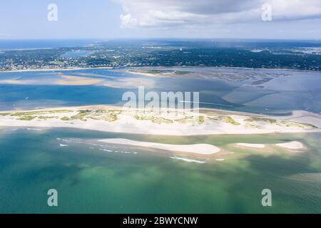 The cold waters of the Atlantic Ocean wash onto the beaches of Cape Cod, Massachusetts. This New England peninsula is a popular summer destination. Stock Photo