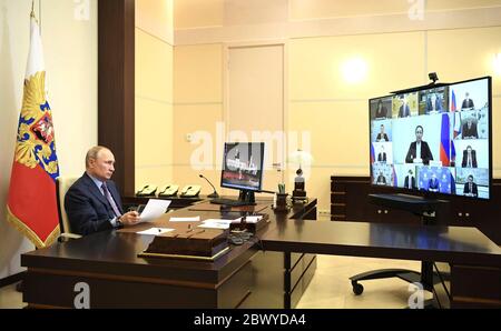 Novo-Ogaryovo, Russia. 03rd June, 2020. Russian President Vladimir Putin, chairs a meeting via video conference to discuss light industry under the pandemic from his office at the Novo-Ogaryovo state residence June 3, 2020 outside Moscow, Russia. Credit: Aleksey Nikolskyi/Kremlin Pool/Alamy Live News Stock Photo