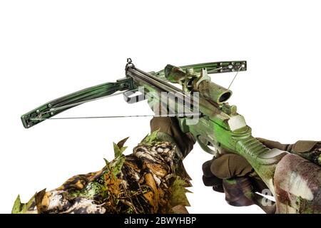 Isolated photo of a first person view hunter hands in forest camouflaged suit holding crossbow on white background. Stock Photo