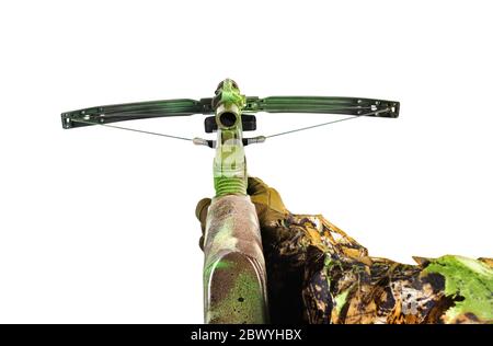 Isolated photo of a first person view hunter hand in forest camouflaged suit holding crossbow on white background front view. Stock Photo