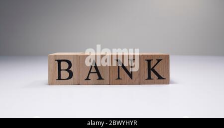 Bank word on wooden cubes in white background. Stock Photo