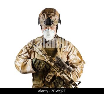 Isolated photo of a fully equipped soldier standing and posing armed ...