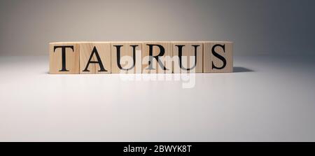 Taurus word on wooden cubes on white background. Stock Photo