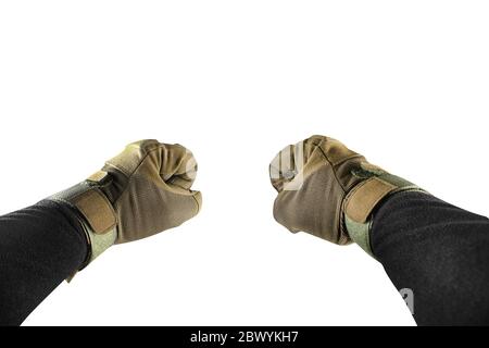 Isolated first person view photo of arm fists in tactical gloves and black jacket. Stock Photo