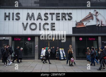 Closed HMV His Master's Voice shop on London's Oxford Street with shoppers walking in front. London Stock Photo