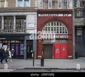 Old disused Strand London Underground station. Old red bricked building with Piccadilly Rly sign. London Stock Photo