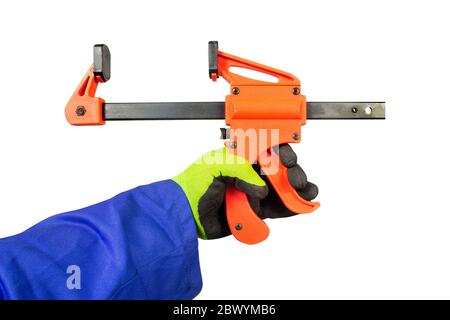Isolated photo of a worker hand in gloves holding one-handed bar clamp horizontally, first person view on white background. Stock Photo