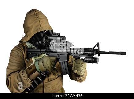Isolated photo of a desert post-apocalyptic soldier in tactical jacket, gas mask, gloves, rifle and armor aiming on white background profile view. Stock Photo