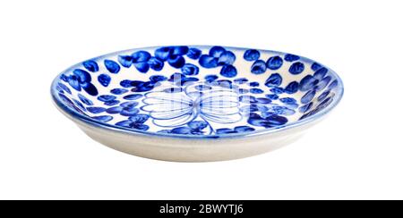 ceramic dish with blue patterns isolated on white Stock Photo