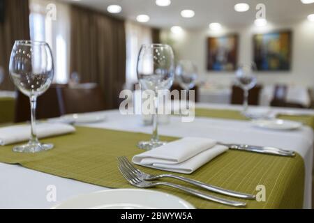 Focus on wine glasses on table in restaurant Stock Photo