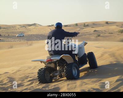 The desert safari provides about 20 minutes of exciting dune bashing along with electrifying camp journey where you can enjoy quad biking, camel ride and sand skiing. Emirati dinner at a Bedouin-style camp. Including camp fires and belly dancing. Stock Photo
