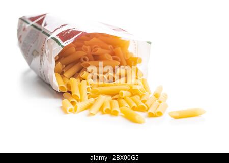 Uncooked penne pasta in bag. Dried italian pasta isolated on white background. Stock Photo