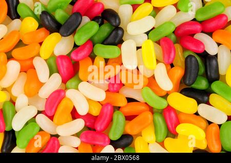 Colourful jelly bean shaped candy sweet background Stock Photo