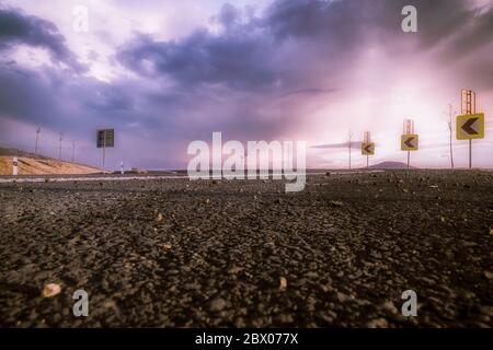 A street on a purple cloudy sky Stock Photo