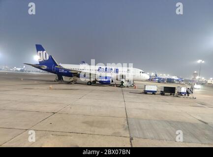 NEW DEHLI, INDIA - MARCH 12, 2020: GoAir Airbus A320 at INDRA GANDHI International Airport. Night view of IGI airport New Delhi. Stock Photo