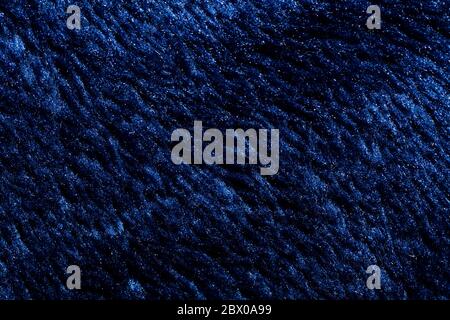 Close-up view of a piece of dark blue fabric. Macro shot. Texture. Stock Photo