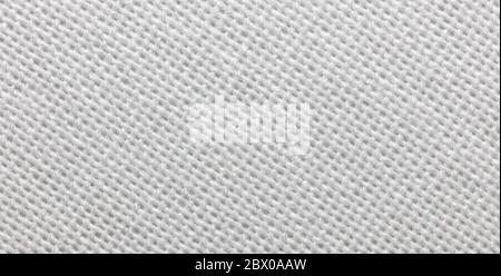Close-up view of a piece of white fabric. Macro shot. Texture. Stock Photo
