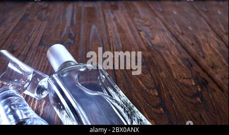 Bottle vodka tequila gin on wooden table with copy space. View from above. Selective focus, close up Stock Photo