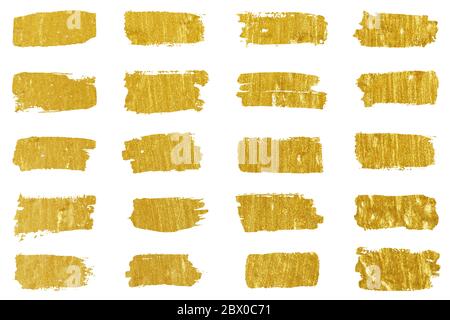 Collection of golden paint strokes. Grunge abstract hand painted element gold strokes with a brush. Stock Photo