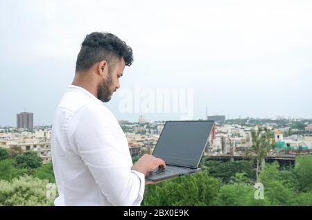 young man working on laptop Stock Photo
