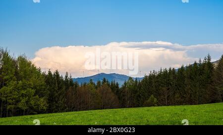 Germany, Thunderstorm clouds and dramatic sky weather forming over endless black forest nature landscape Stock Photo