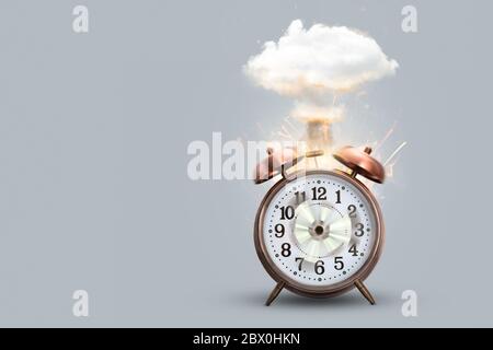 Exploding alarm clock - funny out of time concept Stock Photo