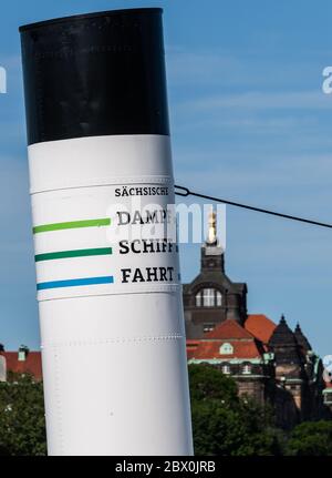 03 June 2020, Saxony, Dresden: The chimney of the paddle steamer 'Dresden' can be seen in front of the dome of the Saxon state chancellery. The Sächsische Dampfschiffahrt Dresden (SDS) has filed for insolvency. The background is financial difficulties, for which the SDS had blamed the missing tranche of a loan from the Free State last week. The 'White Fleet' operates with nine paddle steamers built between 1879 and 1929 as well as two modern passenger ships and is considered the oldest and largest fleet of paddle steamers in the world. Photo: Robert Michael/dpa-Zentralbild/dpa Stock Photo