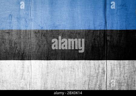 National flag of Estonia depicting in paint colors on an old brick wall ...