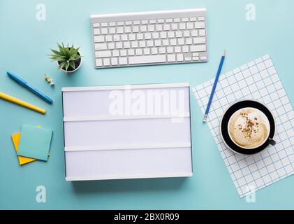 Top view of worktable with cinema light box and accessories.Business flat lay background.start a day.copy space Stock Photo