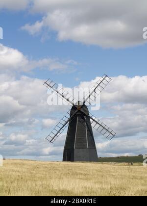 Beacon Mill windmill, standing in a field near the A259 at Rottingdean, East Sussex Stock Photo