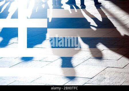 Shadows of people and flag of Greece as background, concept picture Stock Photo