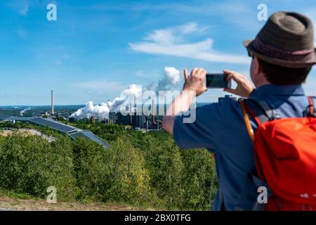 View from the slagheap at Beckstrasse, Tetraeder Halde, to the coking plant Prosper and the ski hall, hikers, walkers, Bottrop, Germany, Stock Photo