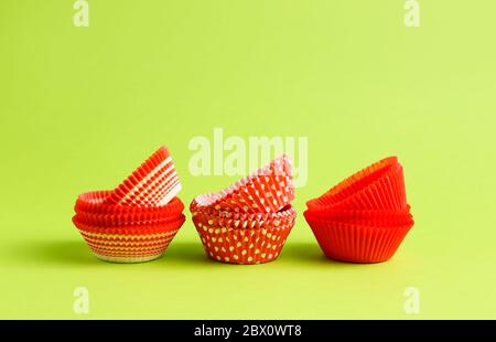 Muffin baking cups on color background Stock Photo
