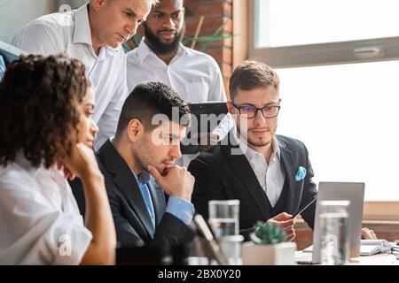 Coworkers Sitting Having Problem Thinking On Solution In Office Stock Photo