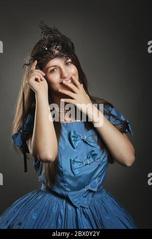 Beautiful woman in blue princess dress with black mask . Venice carnival  portrait Stock Photo - Alamy