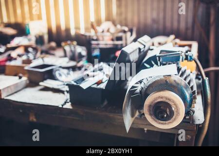Locksmith - mess on the table - sharpening machine Stock Photo