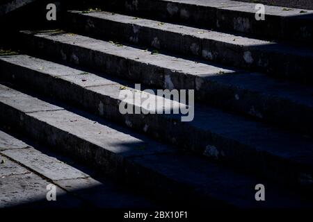 Grungy stone stairway and leaves in black and white Stock Photo