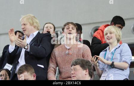 Mayor Boris Johnson with family Milo and Theo Johnson Wheeler (right) celebrating the British Team Persuit at the London Prepares UCI Track Cycling World Cup at the new Velodrome in the Olympic Village London Stock Photo