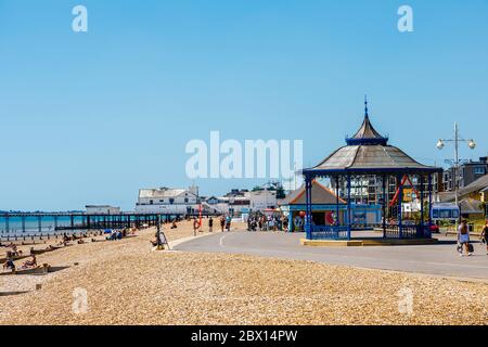 The Esplanade promenade running along the shingle beach and the bandstand at Bognor Regis, a seaside town in West Sussex, south coast England Stock Photo