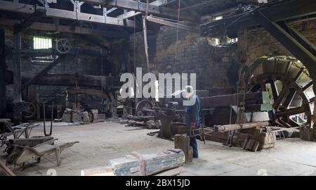 Interior view of Wortley Top Forge, an ancient water powered heavy iron forge now an industrial museum in Thurgoland, South Yorkshire Stock Photo